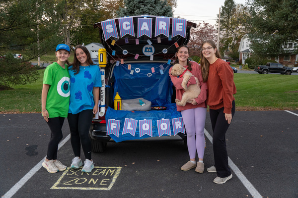 Representation of the achievement named 'Over 80 students volunteer for RHA Trunk-or-Treat, drawing record number of attendees'.