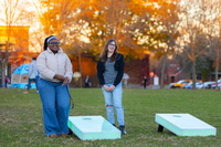 Students play glowing cornhole at SUNY Potsdam's Festival of Light.