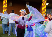 Brynne Sharlow and fellow members of the Potsdam Dance Company performance team donned glowing wings to entertain visitors.