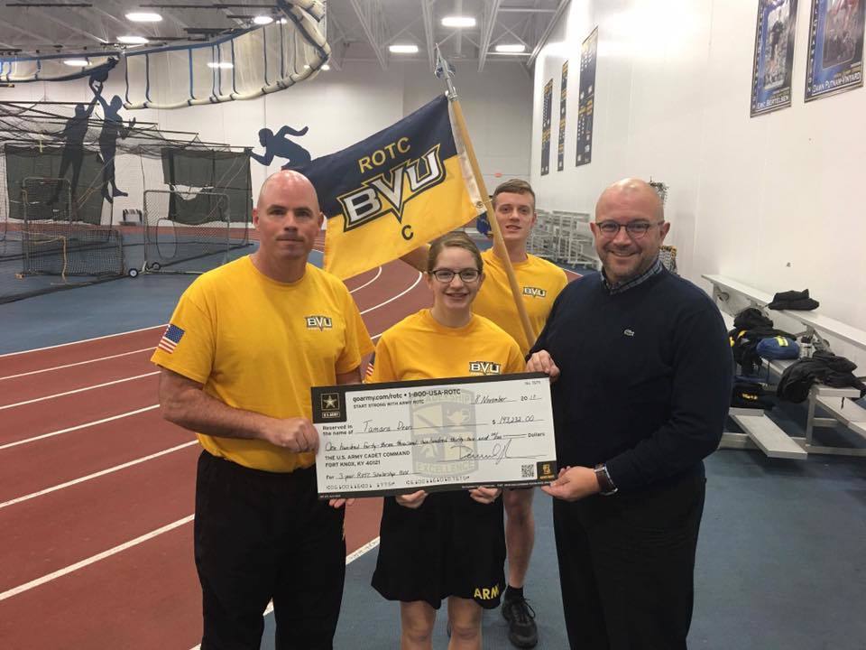 Front row l rcpt daniel manor tamara dean and bvu president joshua merchant. back row tyler smith