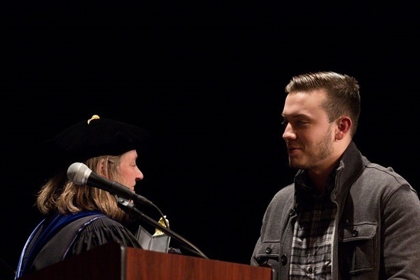 Representation of the achievement named 'Andrew Bernucca Receives the Political Science Scholarship Award'.