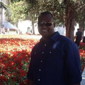 Gregory Holman’s headshot.