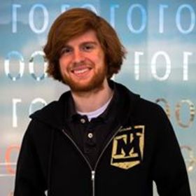 Adam McLaughlin’s headshot.