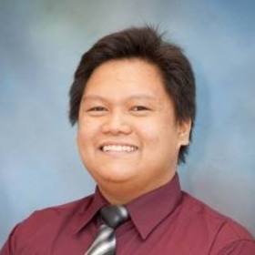 Christian Santos’ headshot.