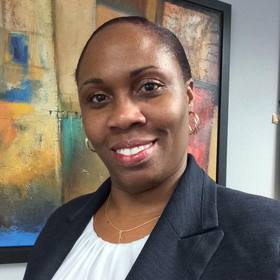 Vinus Alscott’s headshot.