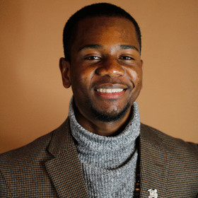 Cameron Benton’s headshot.