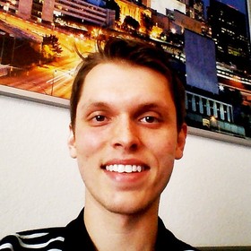 Stefan Santavicca’s headshot.