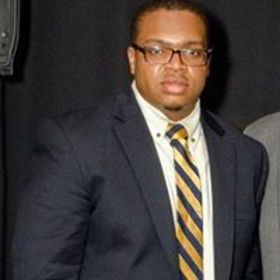 Joshua Suttle’s headshot.