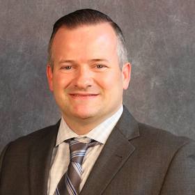 Charles Langley’s headshot.