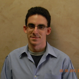Joseph Dinas’ headshot.