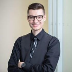 Evan Adler’s headshot.