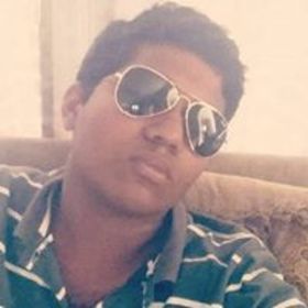 Guruganesh Rajaraman’s headshot.