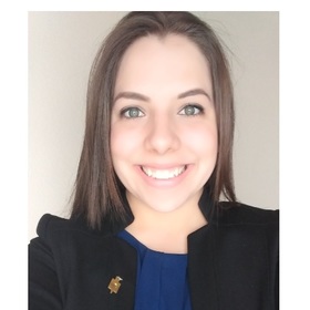 Lia Machado’s headshot.