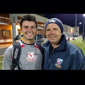 John Abom’s headshot.