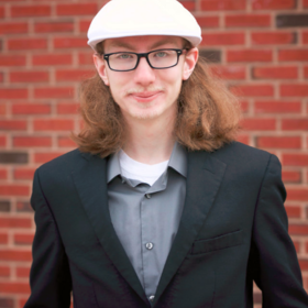 Alexander Wilson’s headshot.
