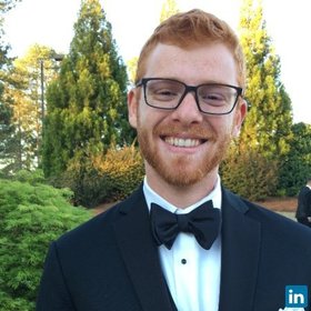 Adam Sasine’s headshot.