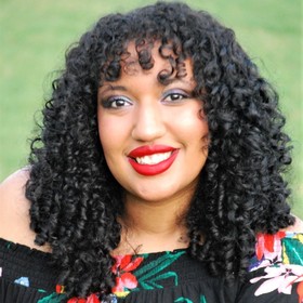 Milan Riddick’s headshot.