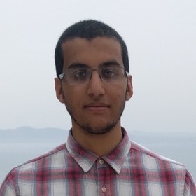 Assil Ksiksi’s headshot.