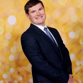 Mitchell Becker’s headshot.