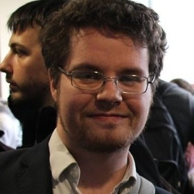 Romain Amuat’s headshot.