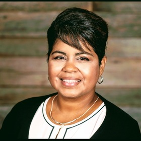 Maria DeJac’s headshot.