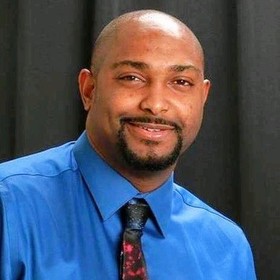 Rascive Grant’s headshot.