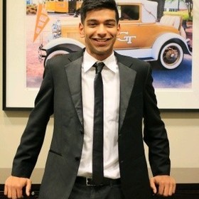 Isaac Joy Solomon’s headshot.