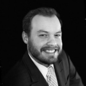 Alexander Roman’s headshot.