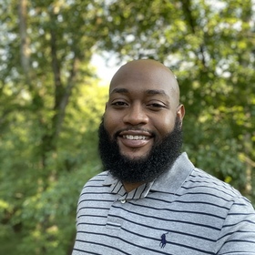 Aaron Praylow’s headshot.