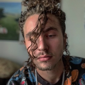 Logan Pins’ headshot.