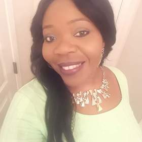 Keneisha Samuels-Grant’s headshot.