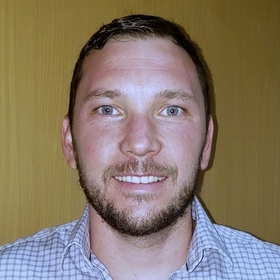 Joshua Fox’s headshot.