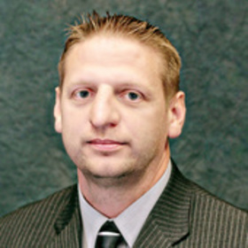 Greg Stanford’s headshot.