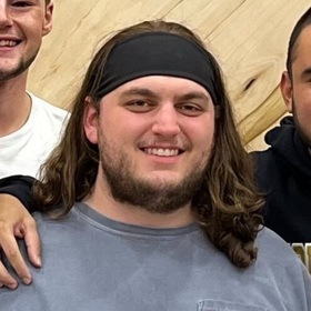 Travis Land’s headshot.