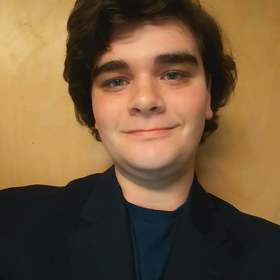 Benjamin Wacter’s headshot.