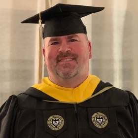 John Haroian III’s headshot.