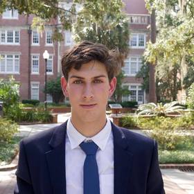 Oliver Hewett’s headshot.