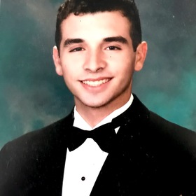 Jonathan Fernandez White’s headshot.