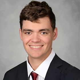 Ryan Riescher’s headshot.