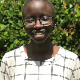 Ajua Longa’s headshot.