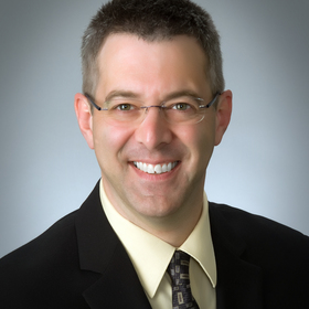 Sam Calabrese’s headshot.