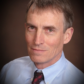 John Otken’s headshot.