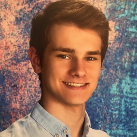 Aleksander Kaluza’s headshot.