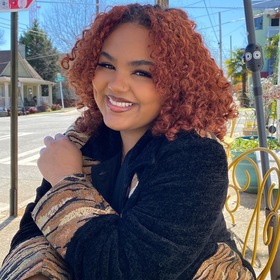 Camely Rubi’s headshot.