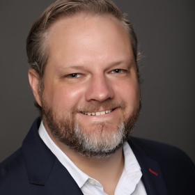 Kevin West’s headshot.