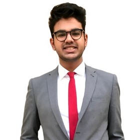 Shivom Dhamija’s headshot.