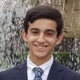 Gregory Elias’ headshot.