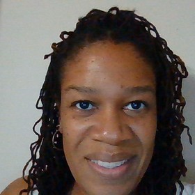 April Remy’s headshot.