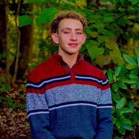 Gregory Allen’s headshot.