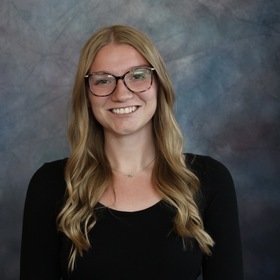 Ali Baker’s headshot.